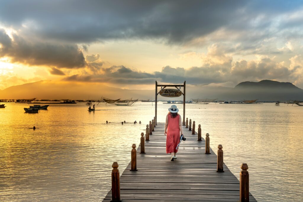 Lady walking on a pier